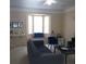 Living room with couches, bay window, and coffee table at 6682 Time Square Ave # 101, Orlando, FL 32835