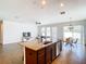 Open concept kitchen with an island and stainless steel appliances at 1508 Caterpillar St, St Cloud, FL 34771