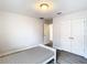 Bedroom with double doors, wood-look floors, and a bed at 1508 Caterpillar St, St Cloud, FL 34771