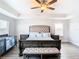 Spacious bedroom with large bed, nightstands, and a crib at 1508 Caterpillar St, St Cloud, FL 34771