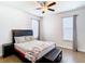 Bedroom with a bed, nightstand, and ceiling fan at 1508 Caterpillar St, St Cloud, FL 34771