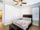 Spacious bedroom with a king-size bed and bench at 1508 Caterpillar St, St Cloud, FL 34771