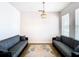 Living room with two sofas, a rug, and a chandelier at 1508 Caterpillar St, St Cloud, FL 34771