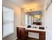 Clean bathroom with a vanity and good-sized mirror at 1508 Caterpillar St, St Cloud, FL 34771