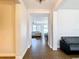 Bright hallway with tile floors and a view into the living room at 1508 Caterpillar St, St Cloud, FL 34771
