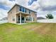Two story home with backyard patio and grass at 1508 Caterpillar St, St Cloud, FL 34771