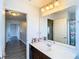Bathroom with vanity, mirror, and access to other rooms at 1508 Caterpillar St, St Cloud, FL 34771