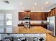 Modern kitchen with granite countertops and stainless steel appliances at 1508 Caterpillar St, St Cloud, FL 34771