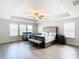Bright bedroom featuring hardwood floors and ample natural light at 1508 Caterpillar St, St Cloud, FL 34771