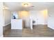 Upper hallway with light wood flooring and access to bedrooms at 1508 Caterpillar St, St Cloud, FL 34771