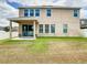 Backyard of home with patio and grass at 1508 Caterpillar St, St Cloud, FL 34771