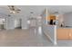 Open kitchen with wood cabinets, stainless steel appliances, and a breakfast bar at 2017 W State Road 426, Oviedo, FL 32765