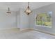 Bright dining room with tile floors and a large window at 2017 W State Road 426, Oviedo, FL 32765