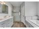 Large bathroom with double vanity, soaking tub and walk-in shower at 2017 W State Road 426, Oviedo, FL 32765