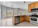 Bright kitchen with stainless steel appliances and an island at 2017 W State Road 426, Oviedo, FL 32765