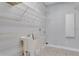 Laundry room with utility sink and ample shelving at 2017 W State Road 426, Oviedo, FL 32765