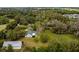 Aerial view of house, pool, barn and surrounding land at 2017 W State Road 426, Oviedo, FL 32765