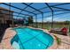 Inviting screened-in pool with lake views at 2588 Shanti Dr, Kissimmee, FL 34746
