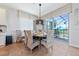 Dining area with table and chairs, overlooking the pool at 2588 Shanti Dr, Kissimmee, FL 34746