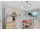Kitchen with island, stainless steel appliances, and breakfast bar at 2588 Shanti Dr, Kissimmee, FL 34746
