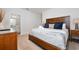 King-size bed, ensuite bathroom access, and a neutral color palette at 2588 Shanti Dr, Kissimmee, FL 34746