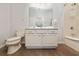 Clean bathroom with a tub, shower, and updated vanity at 2588 Shanti Dr, Kissimmee, FL 34746