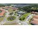 Aerial view of community with lake and homes at 2588 Shanti Dr, Kissimmee, FL 34746