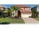 Two story home with tile roof and landscaping at 2588 Shanti Dr, Kissimmee, FL 34746