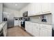 Bright kitchen with white cabinets and granite counters at 2588 Shanti Dr, Kissimmee, FL 34746