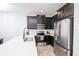 Modern kitchen with stainless steel appliances and white quartz countertops at 2135 Valencia Blossom St, Clermont, FL 34711