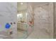 Spa-like shower with marble tile and multiple shower heads at 1112 N Peninsula Ave, New Smyrna Beach, FL 32169