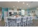 Spacious kitchen with a large island and white cabinets, perfect for entertaining at 1112 N Peninsula Ave, New Smyrna Beach, FL 32169