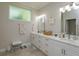 Elegant bathroom with double vanity and large walk-in shower at 1112 N Peninsula Ave, New Smyrna Beach, FL 32169