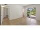 Bedroom with access to patio and adjacent bathroom at 1000 S Orlando Ave # A5, Maitland, FL 32751
