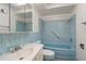 Bathroom with blue tile and a light blue bathtub at 1000 S Orlando Ave # A5, Maitland, FL 32751