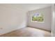 Bright bedroom with tile flooring and window view at 1000 S Orlando Ave # A5, Maitland, FL 32751