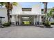 Maitland Harbour building entrance with lush landscaping at 1000 S Orlando Ave # A5, Maitland, FL 32751