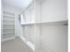 Spacious walk-in closet with ample shelving and hanging rods at 3480 Fairway Ln, Orlando, FL 32804