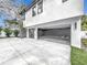Two-car garage with ample space and dark-painted walls at 3480 Fairway Ln, Orlando, FL 32804