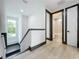 Modern hallway with stylish dark trim and a view of a bathroom at 3480 Fairway Ln, Orlando, FL 32804