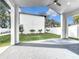 Covered patio with ceiling fan, providing shade and relaxation at 3480 Fairway Ln, Orlando, FL 32804