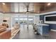 Basement bar with dark wood ceilings, blue cabinets, and herringbone floors at 9832 Laurel Valley Dr, Windermere, FL 34786