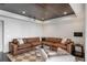 Comfortable basement sitting area with a large sectional sofa and coffee table at 9832 Laurel Valley Dr, Windermere, FL 34786