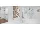 Luxurious bathroom with soaking tub, walk-in shower, and marble accents at 9832 Laurel Valley Dr, Windermere, FL 34786