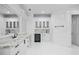 Elegant bathroom with white cabinetry, marble countertops, and walk-in shower at 9832 Laurel Valley Dr, Windermere, FL 34786