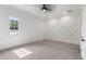 Bright bedroom with a ceiling fan and decorative wall at 9832 Laurel Valley Dr, Windermere, FL 34786