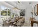 Spacious dining room with large windows and a wooden table at 9832 Laurel Valley Dr, Windermere, FL 34786