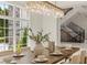 Formal dining room with a long wooden table and chandelier at 9832 Laurel Valley Dr, Windermere, FL 34786