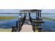 Private dock with covered seating area on the lake at 9832 Laurel Valley Dr, Windermere, FL 34786
