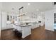 Gourmet kitchen with double islands, white cabinets, and a view at 9832 Laurel Valley Dr, Windermere, FL 34786